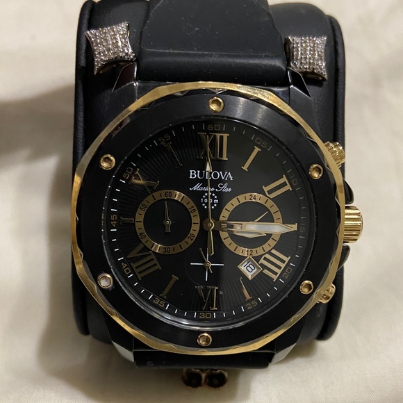 100 meter Bulova watch and 1/8 carat 10k gold earrings